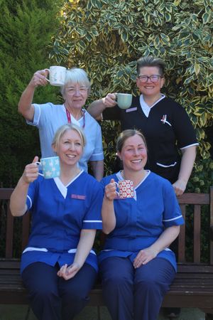 Care staff from the hospice raising a cuppa 