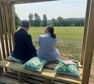 Marc Jordan, left, and Principal Rachael Sandham, right, look out over the newly landscaped area.