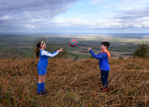 Pupils Kelsey Masefield, aged 11 and Harry Hindley, aged 8, from Newdale Primary School, warm up against the beautiful view