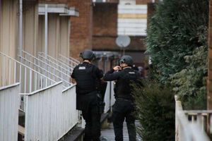 Officers outside the Stafford flat, picture: Paul Milgate