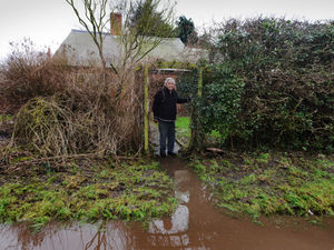 Supporting image for story: Trudge over fields to take shopping home as lane near Shrewsbury keeps flooding 
