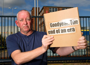 Wayne Devaney, who worked at the site for 28 years, with his scrap book of memories