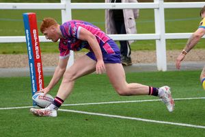 Luis Roberts scores the first of his two tries in the corner. Photo: Andy Shaw
