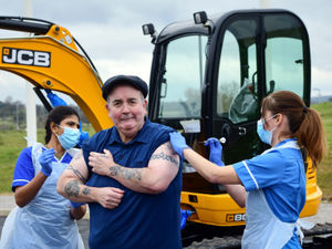 Supporting image for story: Darts ace Phil powers on after getting jab