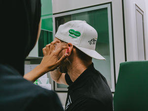 Shane Kelly, driver for UWR, having his bespoke ear plugs fitted by Specsavers Telford audiologist, Aysha Siddiqa