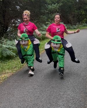 Jess and Christina take on their 7KM walk dressed as Leprechauns