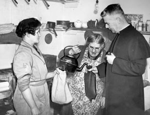 February 1947: 'To help worshippers to keep warm in church, the Rev W Ellis, vicar of St George's, Wolverhampton, offered to fill hot water bottles at the vicarage. He is seen doing this with the housekeeper, Mrs Morpuss, and other parishioners in the vicarage kitchen,' The background was that the winter of 1947 was both harsh and there were coal shortages leading to a fuel crisis and power cuts.