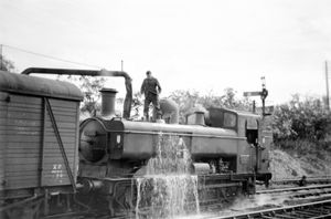 This picture taken by Les shows a steam locomotive taking on water at Market Drayton in the summer of 1963.