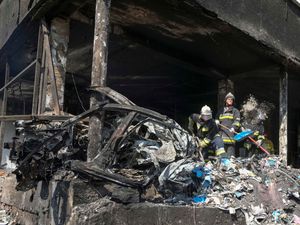 Supporting image for story: Rescue teams search for survivors after deadly Russian missile strike