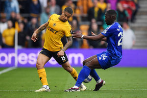 Joao Gomes battles for the ball during Wolves' clash with Leicester City  (Photo by Joe Prior/Getty Images)