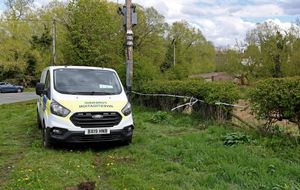 A forensics vehicle parked up at the scene