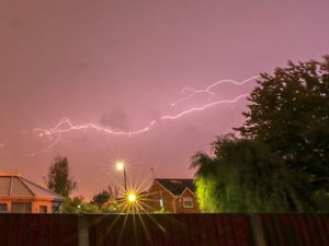A lightning strike goes across the sky