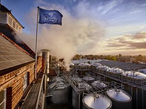 A Shepherd Neame flag flying at a brewery