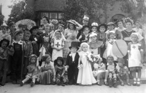 A street party to mark VE Day at Harlescott Close, later Roselyn, Shrewsbury. Glenys Richards. with the ribboned crook, played Bo-Peep, with front left, Michael Richards, and back, third from right in flat cap Peter Richards as Robin Hood. Also in picture is their father. Fred Richards, back row in top hat.