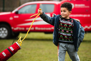Market Drayton Fire Service are providing half term activities at The Zone in Market Drayton. Here, Firefighter Barry Plant is teaching children how to use a throw line as well as trying on Fire Helmets. In Picture: Jay Jay