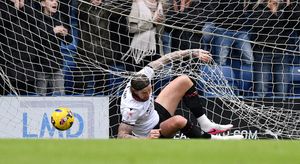 Aden Flint can't stop the ball from hitting the back of the net as Chesterfield make it 2-0.