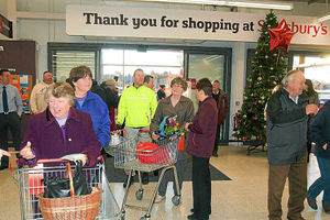 Shoppers arrive at the new Whitchurch Sainsbury's store for the first time
