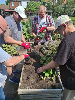 Members of Caldmore men's gardening club