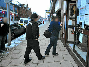 Supporting image for story: 100 officers swoop to smash benefits racket