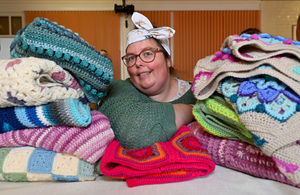 Sara Wainwright with blankets she had made to sell