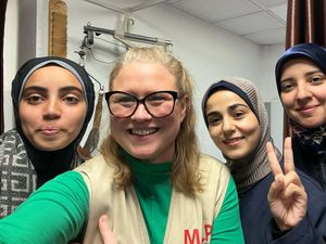 Rachael Moses with a group of smiling women