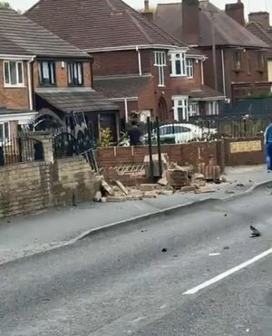 The wall of a house was left severely damaged after the collision