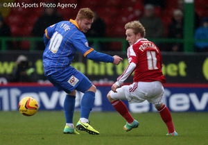 Fraser Fyvie of Shrewsbury Town and Alex Pritchard of Swindon Town