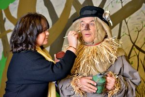 Scarecrow Dave Holbrook has his make-up touched up by director Michele Lee