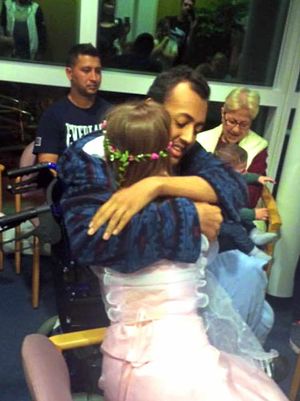 Omar Al Skaikh embraces his new wife