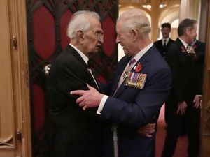 Supporting image for story: King hugs Second World War veteran, 105, at Windsor remembrance reception