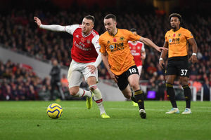 Calum Chambers of Arsenal and Diogo Jota of Wolverhampton Wanderers. (AMA/Sam Bagnall)