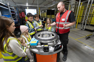 Alex Faithful shows the visitors some of Amazon’s robots