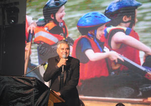Founding trustee Suresh Bawa talks on stage at Wolverhampton Racecourse