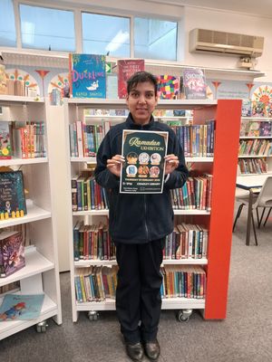 Cradley Library member of staff with the exhibition poster