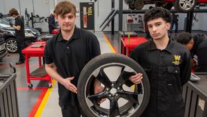 Automotive apprentice Alex Jones, right, and student Yusef Ahmed pictures in the workshop at the advanced Technology and Automotive Centre
