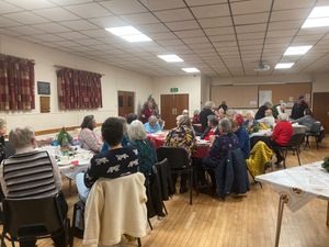 New president, Janet Jones, welcomes members to the Christmas meeting