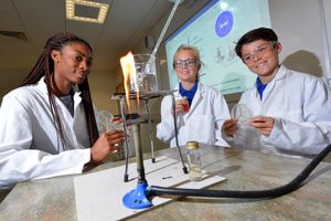 Concord sixth-former Adebola Osuntoki 17 with Longnor CE Primary School pupils Ben Willis and Sophie Eastwood, both 11, testing water for cleanliness