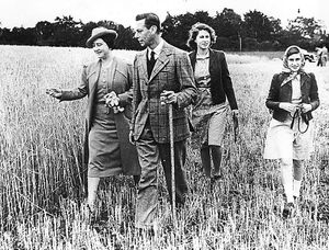 Away from the turmoil of World War II, King George VI and Queen Elizabeth walk with their daughters Princess Elizabeth, left, and Princess Margaret
