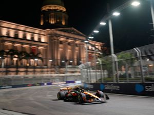 Supporting image for story: Lando Norris breaks front wing after pit collision during Singapore GP practice