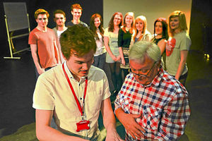 Malcolm Lord with HND Performing Arts students and teacher Michael Jenkins 