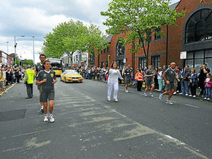 Supporting image for story: Thousands of people greet the Olympic Torch in Staffordshire