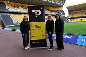 TPSquared Team: Harriet Leith - Graphic Designer, Carolyn Smith – Managing Director and Claire Ash - Senior Graphic Designer stood pitchside at the Molineux.
