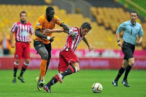 Sheffield United's Florent Cuvelier (right) is tackled by Wolverhampton Wanderers' Bakary Sako