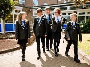 Supporting image for story: Children return to the classrooms after the summer break as Covid restrictions as relaxed in favour of testing