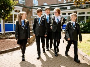 Supporting image for story: Children return to the classrooms after the summer break as Covid restrictions as relaxed in favour of testing