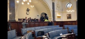 Police officers ask SCARF protestors to leave the chamber at Staffordshire County Council. Photo by Phil Corrigan. Free for all LDRS partners to use. 