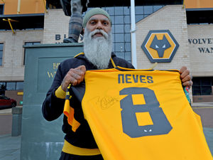 Supporting image for story: Signed Wolves shirt raises thousands for charity in raffle