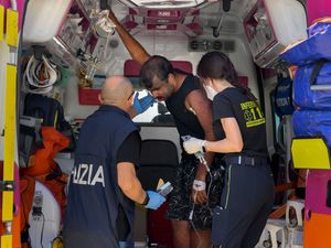 Supporting image for story: Italian coast guard searches for migrants after boat sinks off Calabrian coast