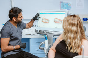 Dr Chetan Sharma doing an invisalign consultation 