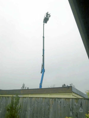 The worker is stuck up high